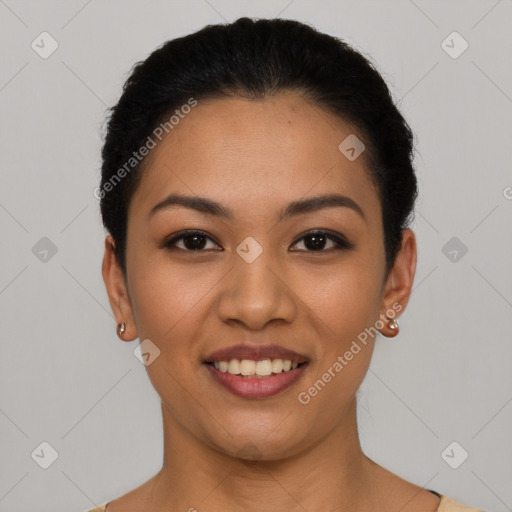 Joyful latino young-adult female with short  black hair and brown eyes