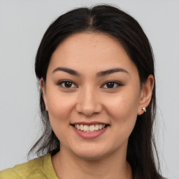 Joyful asian young-adult female with medium  brown hair and brown eyes