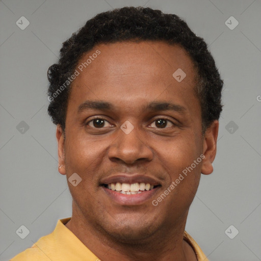 Joyful latino young-adult male with short  brown hair and brown eyes