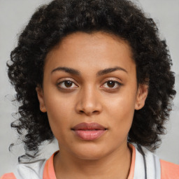 Neutral black young-adult female with medium  brown hair and brown eyes