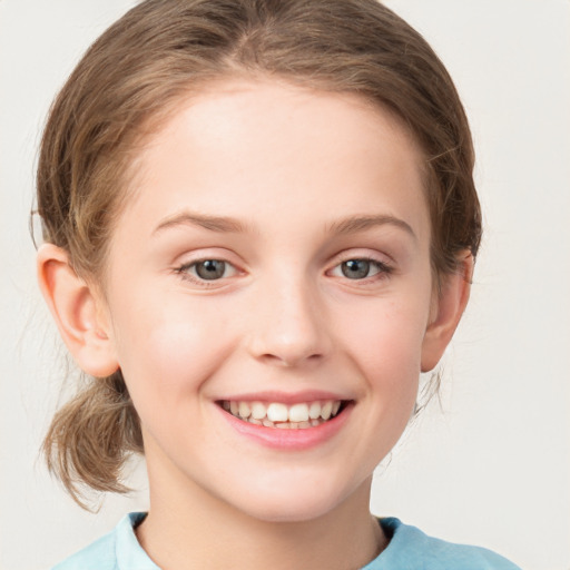 Joyful white child female with medium  brown hair and grey eyes