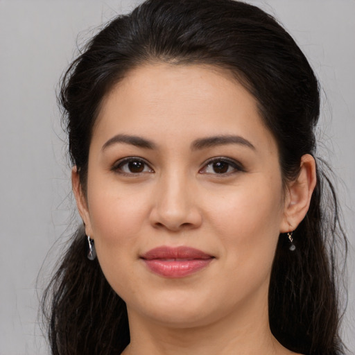 Joyful white young-adult female with long  brown hair and brown eyes