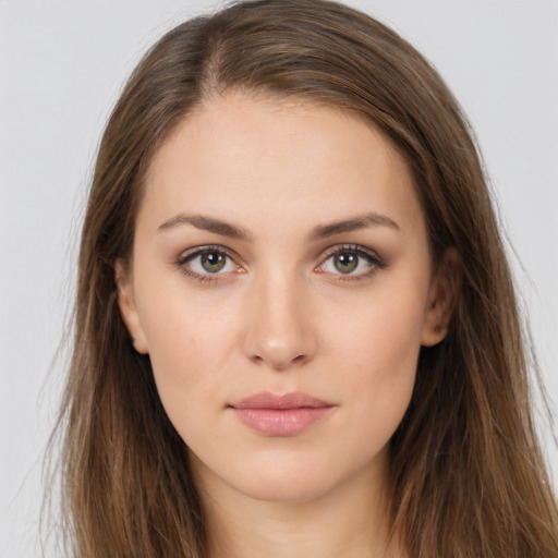 Neutral white young-adult female with long  brown hair and brown eyes