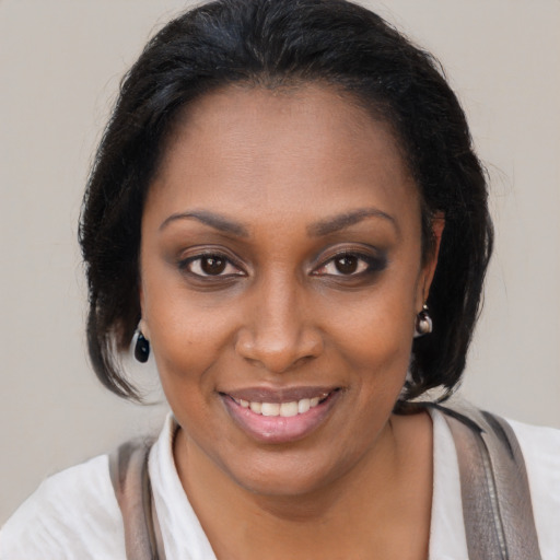 Joyful black young-adult female with medium  brown hair and brown eyes