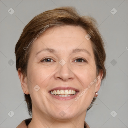 Joyful white adult female with medium  brown hair and brown eyes