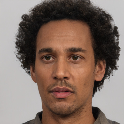 Neutral latino adult male with short  black hair and brown eyes