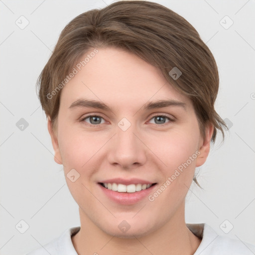 Joyful white young-adult female with short  brown hair and grey eyes