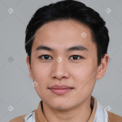 Joyful asian young-adult male with short  black hair and brown eyes