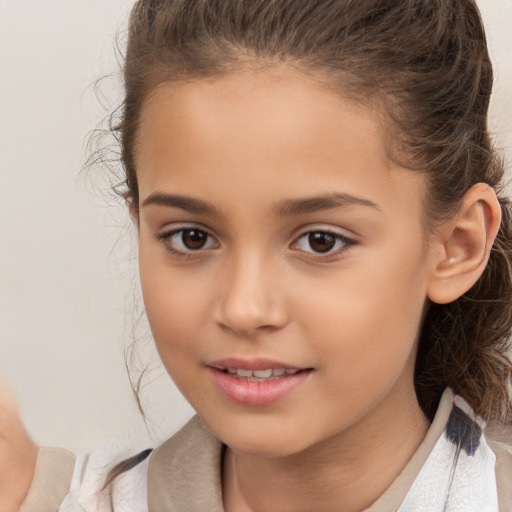 Joyful white child female with medium  brown hair and brown eyes