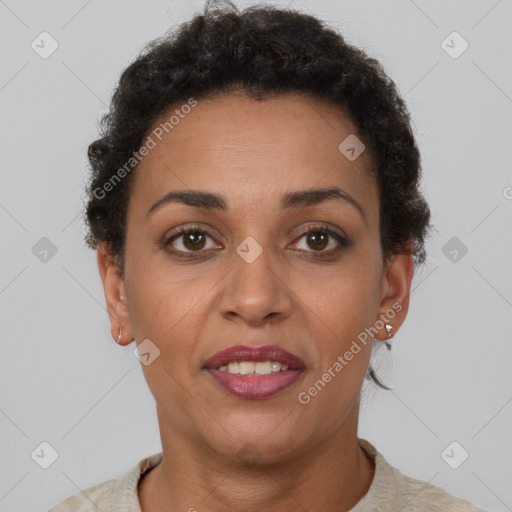 Joyful latino adult female with short  brown hair and brown eyes