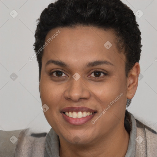 Joyful black young-adult female with short  brown hair and brown eyes