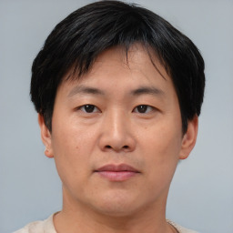 Neutral asian young-adult male with short  black hair and brown eyes