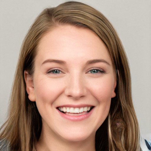 Joyful white young-adult female with long  brown hair and grey eyes