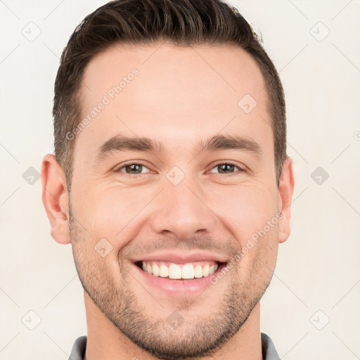 Joyful white young-adult male with short  brown hair and brown eyes