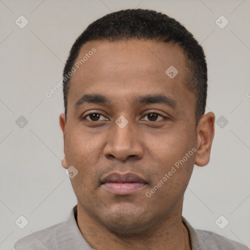 Neutral latino young-adult male with short  black hair and brown eyes