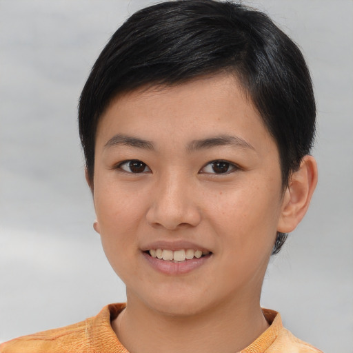 Joyful asian young-adult female with short  brown hair and brown eyes
