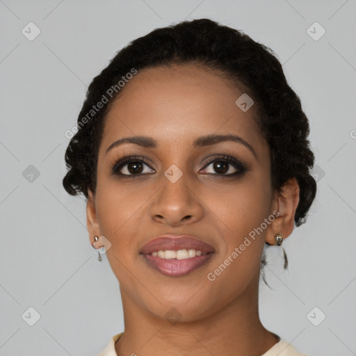 Joyful black young-adult female with short  black hair and brown eyes