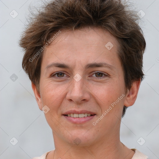 Joyful white adult female with short  brown hair and brown eyes