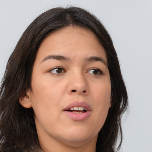 Joyful asian young-adult female with long  brown hair and brown eyes