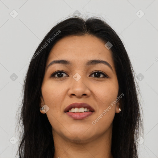 Joyful latino young-adult female with long  brown hair and brown eyes