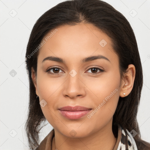 Joyful latino young-adult female with long  brown hair and brown eyes