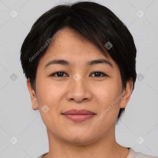 Joyful asian young-adult female with short  brown hair and brown eyes