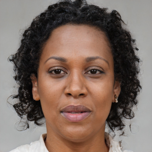 Neutral black adult female with long  brown hair and brown eyes