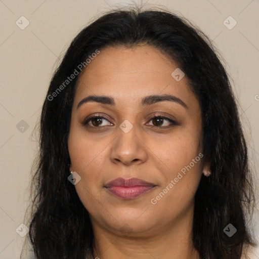 Joyful latino young-adult female with long  brown hair and brown eyes