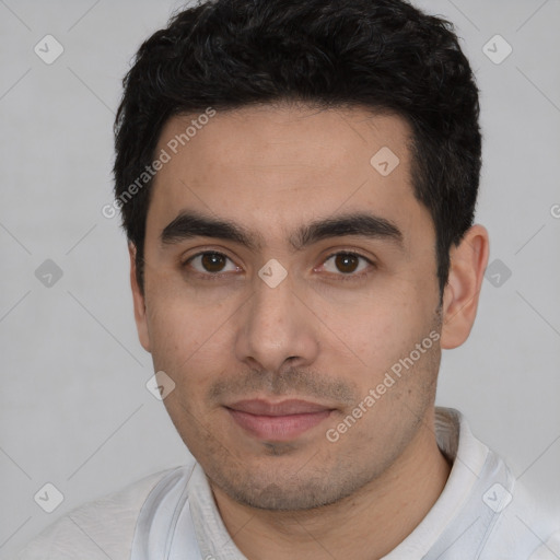 Joyful white young-adult male with short  black hair and brown eyes