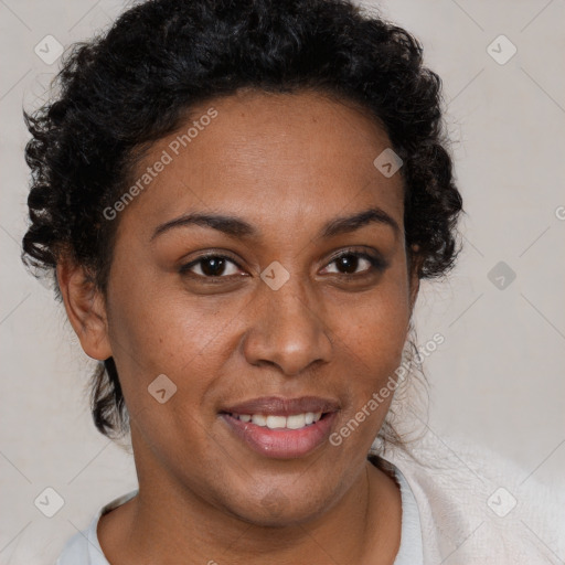 Joyful black adult female with short  brown hair and brown eyes