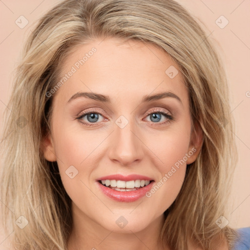 Joyful white young-adult female with long  brown hair and blue eyes