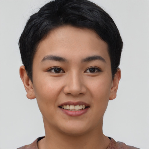 Joyful asian young-adult female with short  black hair and brown eyes
