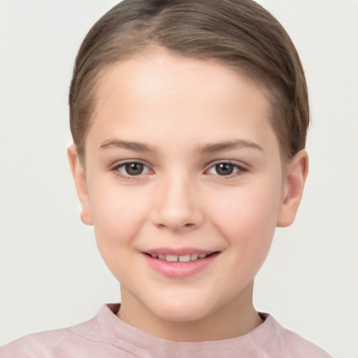 Joyful white child female with short  brown hair and brown eyes