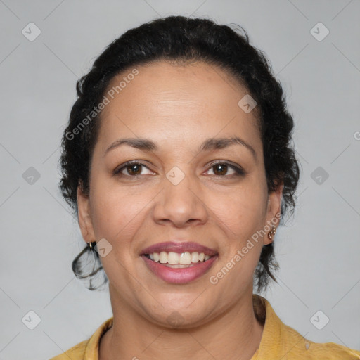 Joyful latino adult female with short  brown hair and brown eyes