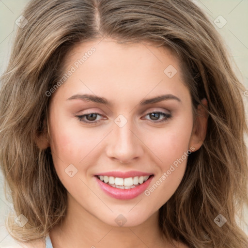 Joyful white young-adult female with long  brown hair and green eyes