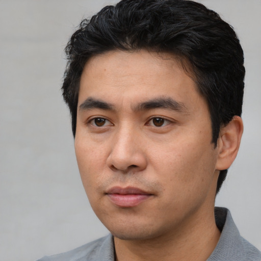 Neutral asian young-adult male with short  black hair and brown eyes
