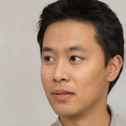 Neutral asian young-adult male with short  black hair and brown eyes