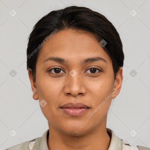 Joyful latino young-adult female with short  black hair and brown eyes