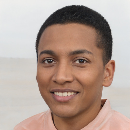 Joyful black young-adult male with short  black hair and brown eyes