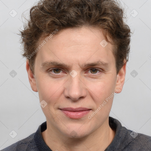 Joyful white adult male with short  brown hair and grey eyes