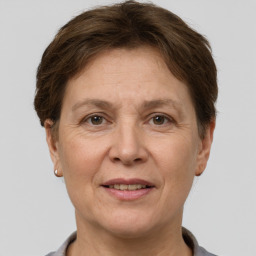 Joyful white adult female with short  brown hair and grey eyes