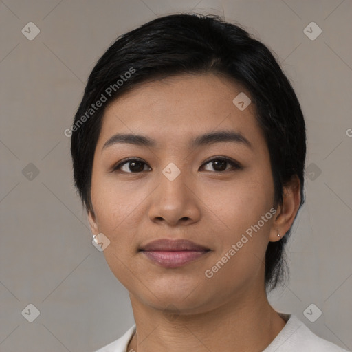 Joyful asian young-adult female with medium  black hair and brown eyes