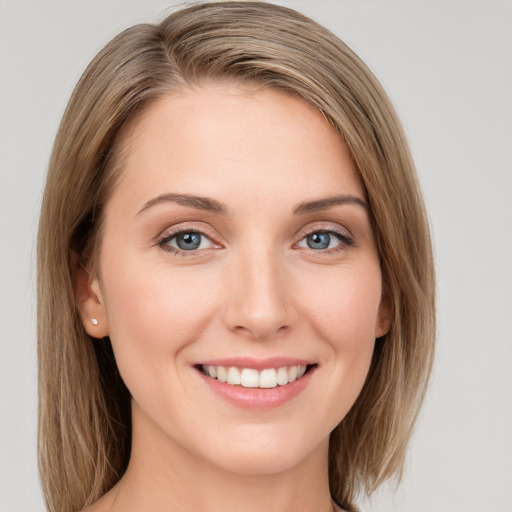 Joyful white young-adult female with medium  brown hair and blue eyes