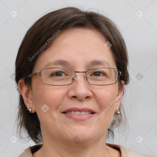 Joyful white adult female with medium  brown hair and grey eyes