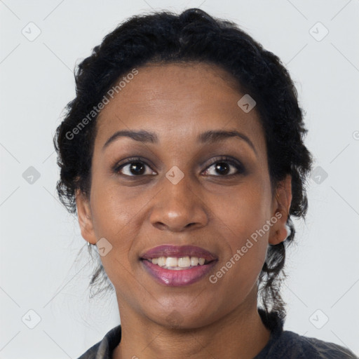 Joyful black young-adult female with medium  brown hair and brown eyes