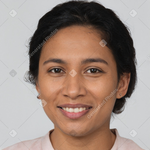 Joyful latino young-adult female with medium  brown hair and brown eyes