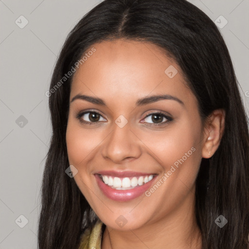 Joyful latino young-adult female with long  brown hair and brown eyes