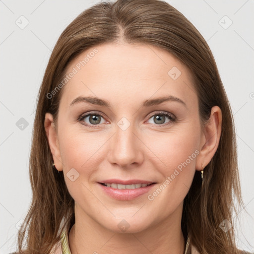 Joyful white young-adult female with long  brown hair and grey eyes