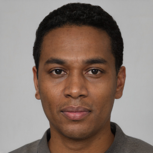 Neutral black young-adult male with short  black hair and brown eyes