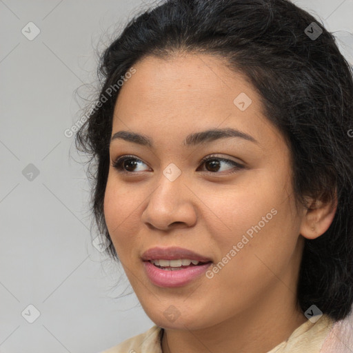 Joyful latino young-adult female with medium  brown hair and brown eyes